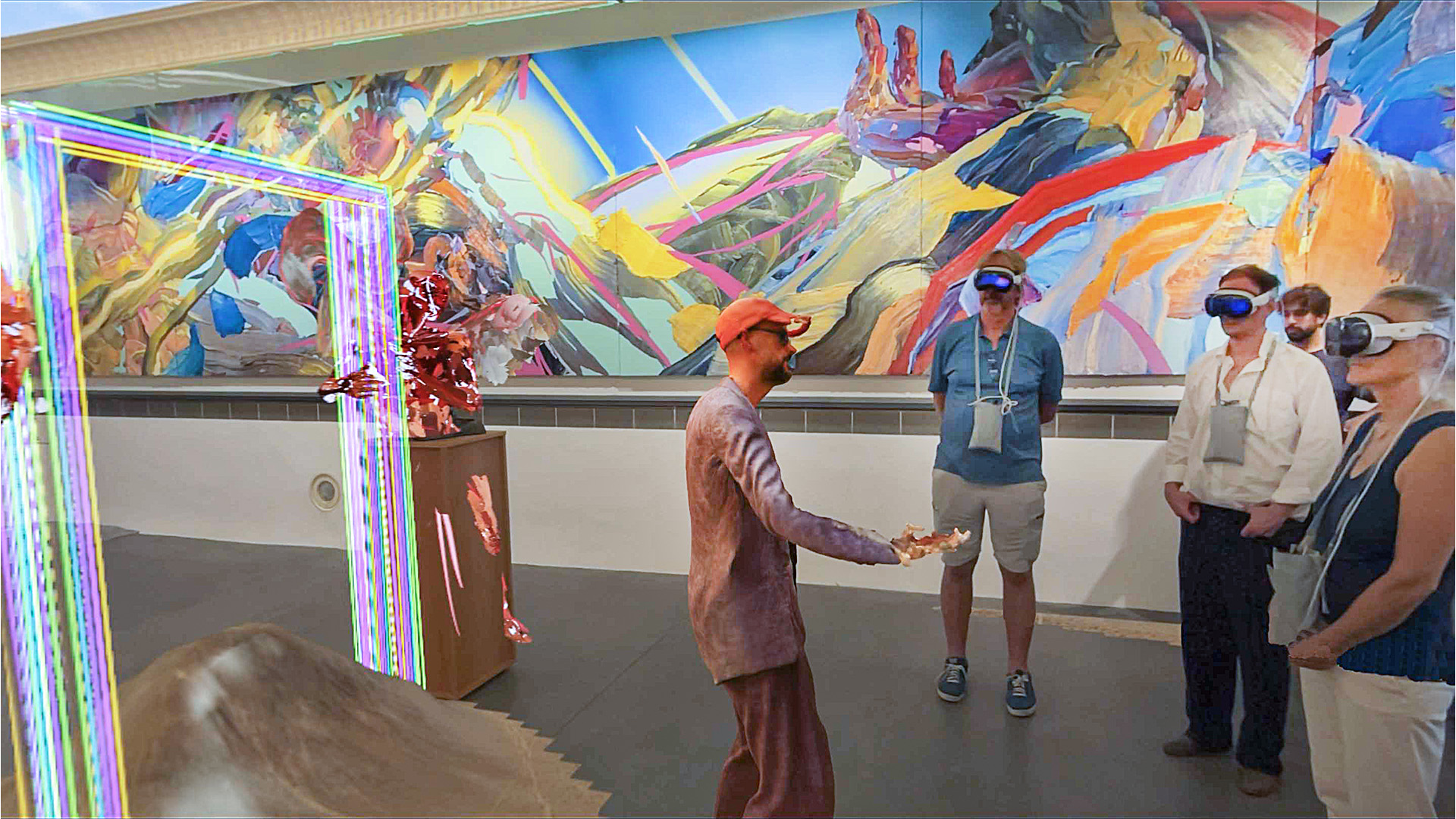 Dennis Rudolph's AI avatar addresses visitors wearing Apple Vision Pro.